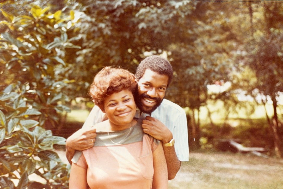 Donna Jean and her husband outdoors, his arms around her