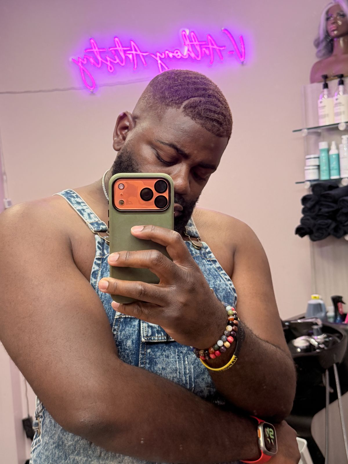 Victor photographing himself in the studio mirror after a haircut